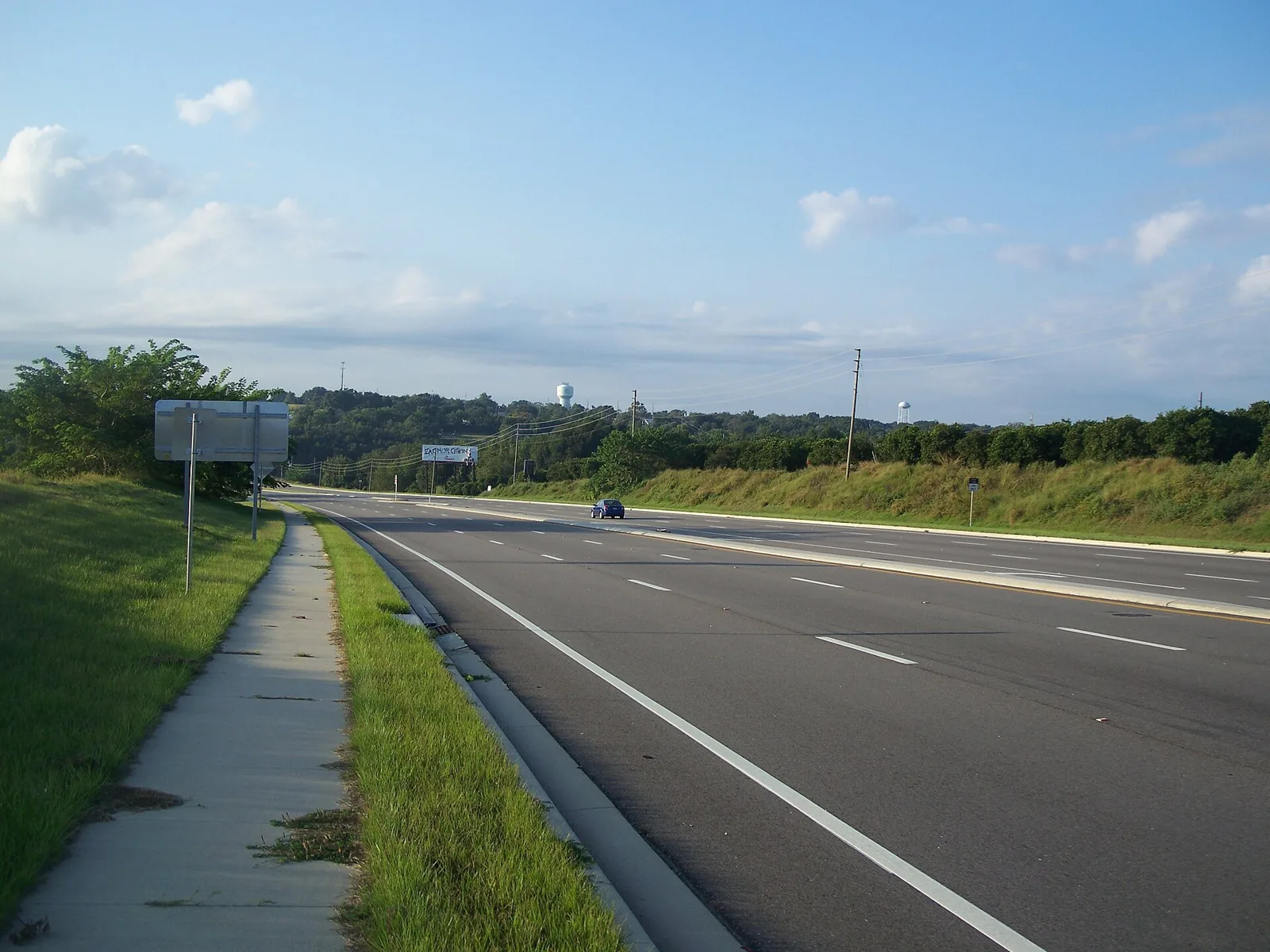 U.S. 27 heading south through Clermont, with the city's water towers on the ridge.
